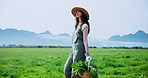Thinking, farm and woman with basket walking in field for growth, harvest and natural produce. Agriculture, nature and farmer with organic food for sustainable gardening, ecology and crops outdoor