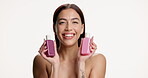 Face, woman and beauty bottles in studio for skincare serum, hydration treatment and healthy glow. Mockup space, girl and happy with retinol oil on white background for anti aging and hyaluronic acid