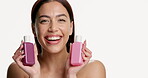 Face, woman and bottles for skincare in studio for advertising, collagen and choice for serum. Portrait, person and smile for cosmetic product, hyaluronic acid comparison and glow on white background