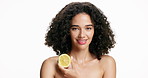 Woman, face or skincare with lemon in studio for vitamin C or fiber on a white background. Portrait, female person or model with smile, natural organic citrus fruit or detox for antioxidant on space
