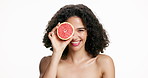Happy woman, face or skincare with grapefruit for vitamin C on a white studio background. Portrait, female person or model with smile, natural organic fruit or detox for antioxidant or nutrition