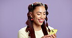 Happy, girl and browsing with phone in studio for social media post, status update or app download. Mockup space, gen z person or smile with smartphone on purple background for texting or online news