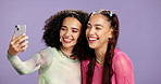 Selfie, happy and girl friends in studio with makeup, self care and facial cosmetology together. Smile, phone and women with beauty for photography picture with laugh and bonding by purple background
