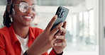 Hands, phone and texting in office at startup with contact, scroll or chat on break at media company. Person, smartphone and happy with mobile app, notification and social media at creative agency