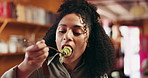 Tasting, meal and woman in kitchen, chef and delicious food for hospitality, culinary skills or dish. Eating, cuisine and quality control of flavor, happy and person with satisfaction in restaurant