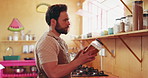 Chef, kitchen and man with spice shelf, learning and ingredients with culinary skills. Choice, person and employee with gourmet cuisine, recipe and herbs with diet, healthy meal and food with jar