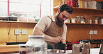 Chef, mortar or man with grinding in kitchen for food spices, personalized menu or catering service. Hospitality industry, culinary startup or person blend ingredients for recipe seasoning or cooking