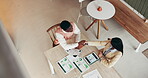 Handshake, above and business people with agreement, partnership and collaboration for financial growth. Analyst, shaking hands and meeting for deal in cafe, company info and data records for trust.