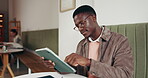 Business, man and scroll with tablet at cafe for research, editing article and newsletter report. Person, freelancer and digital to review draft, email source and information for publication at shop