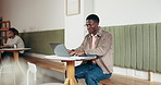 Business, man and typing on laptop at cafe for research, editing article and newsletter report. Person, document or pc to review manuscript, email source and information on publication at coffee shop