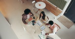 Above, documents and business people in cafe, planning and meeting for proposal feedback. Employees, sales team and cooperation in restaurant, discussion and review for company policy and paperwork