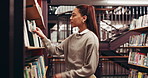 Books, college and woman in library for education, learning or research with knowledge. Studying, project and female student with academic information for university exam or assignment on campus.