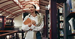 Education, woman or walking with books in library for thesis research, study information or learning. University student, person and search textbooks on campus for PHD citation sources and knowledge