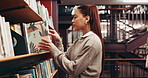 Reading, university and woman with book in library for education, learning or research with knowledge. Studying, project and female student with academic information for college exam on campus.