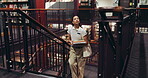 Woman, student and steps with books in library for learning, study resources and assignment research. Female person, walking and stairs with textbook, education material and knowledge of college exam
