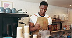 Black man, barista and machine for smoothie at cafe for healthy drink, customer order and diet seeds. Male person, blender and ingredients for protein shake, wellness benefits and hospitality service