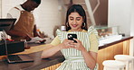 Internet, business and woman in cafe, smartphone and typing with social media, texting and email. Person, customer and cellphone in restaurant, network and digital app with communication and contact
