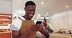 Happy, business and man in cafe, smartphone and typing with social media, texting and email. Person, customer and cellphone in coffee shop, smile and digital app with communication and contact