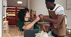 Fist bump, success or men in cafe with laptop for achievement, opportunity or positive feedback. Celebration, waiter or people in restaurant with tech for development, customer service or good review