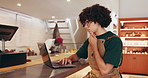 Laptop, man and barista thinking in coffee shop for menu ideas, typing or order stock. Cafe, owner and computer in small business for planning inventory with online sales, reading and problem solving