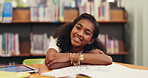 Girl, child and face at library with education, smile or arms crossed with pride with project at school. Kid, portrait and pupil with confidence for development, scholarship and learning in Brazil