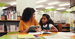 Tutor, child and lesson with tablet in library for elearning, homework assignment and assistance. Academic mentor, girl student and digital app at school for online learning, test preparation or help