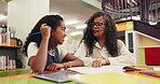 Woman, child or teaching at library with books, happy or concentration for extra class session. Support, student or teacher in school with homework, writing or learning for childhood development.