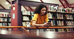 Break, college student or woman with phone in library, typing message or scroll social media to relax. Study pause, smile or person with mobile app in university resource center, text or notification
