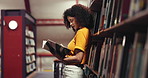 Woman, student and reading with book on bookshelf for choice, knowledge or literature in library. Female person, academic or learning with information or insight for novel or story in bookstore