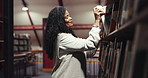 Smile, woman and search for book in library for author choice, research and information on art. Mature teacher, night and reading title of novel for learning, lecture preparation and course knowledge