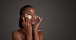 Skincare, gel pad or woman in studio with touch, brighten or hydrate for under eye. Dermatology, antioxidant or black person on gray backdrop with patch, caffeine or hyaluronic acid for dark circles.