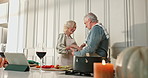 Care, happy and old couple dance in kitchen, streaming music or spin for romantic relationship. Support, love or senior man with woman bonding in home, retirement fun or tech for dinner entertainment