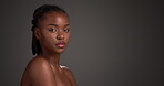 Beauty, skincare and face of black woman in studio for mockup, self care and clear skin glow. Dermatology, shine and hydration with female person on dark background for space, smooth and aesthetic