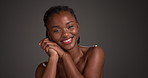 Face, cosmetics and black woman in studio, beauty and dermatology on dark background. Space, skincare and African person with wellness, shine and glow with healthy skin, grooming and treatment