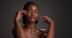 Happy, beauty and face with black woman in studio for dermatology, glow and self care. Skincare, shine and smooth skin with female person on dark background for space,  cosmetology and smile