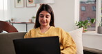 Creative, freelancer and woman with laptop, lounge and proofreading article on website and magazine. Remote work, journalist and person with tech for story, online and editing draft on couch in home