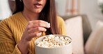 Woman, eating and watching tv in apartment with popcorn for funny show, film and entertainment on weekend. Laughing, female person and snack in home with comedy series, movie and streaming service.