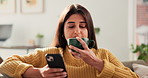 Woman, phone and drinking coffee on sofa with texting, funny chat and relax with online dating in lounge. Person, smartphone and tea cup on couch, mobile app and smile with social media at apartment