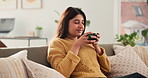 Happy, smell and woman with coffee on sofa for inspiration, reflection and comfortable on weekend. Morning, home and person on couch with drink, warm beverage and aroma for wellness, peace and relax