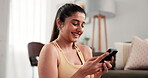 Fitness, woman and laughing with phone on floor for home workout, yoga break and funny text message. Smartphone, person and resting in apartment from exercise, social media browsing and pilates meme