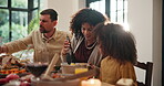 Dinner, family and child in home with food for thanksgiving celebration, feast and share meal. Parents, son and serving dish in house for traditional cuisine, holiday gathering and bonding together.