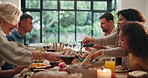 Serving, food or people at family dinner in home to celebrate thanksgiving, relax or chat together. Support, talking or happy group in dining room for holiday reunion, share or pass feast for bonding