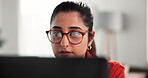 Glasses, laptop and woman with reading in home for proofreading article, remote work and research. Freelancer, journalist and tech in apartment for editing news story, planning or source verification