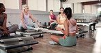Relax, pilates and women in studio, conversation and feedback for progress, challenge and wellness. People, instructor and group with discussion, health and break with technique, fitness and advice