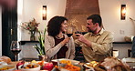 Home, dinner and couple with red wine, toast and bonding together with conversation. Thanksgiving, dining room and people with alcohol, healthy meal or nutrition with happiness, celebration or cheers