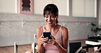 Texting, laugh or mature woman in gym with phone, funny message or training video on digital app. Happy, virtual or female person in club with tech, online tutorial or meme reaction on workout break.