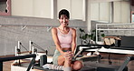 Woman, face and happy at pilates studio for exercise, wellness and relax on break with pride at gym. Person, smile and confident in portrait for workout, routine or training at fitness club in Spain