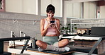 Happy woman, phone and texting at pilates studio for exercise, wellness and relax on break at gym. Person, smile and laugh at meme on web, app and social media with rest for training at fitness club