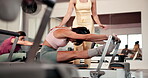 Reformer pilates, woman and stretching with instructor for fitness, exercise challenge and support. Active, female person or coach in yoga studio with help for workout class, flexibility or wellness.