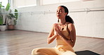 Woman, yoga and breathing with meditation on mat for spiritual wellness, health or zen in studio. Calm, female person or balance with namaste for inner peace, awareness or holistic healing on floor